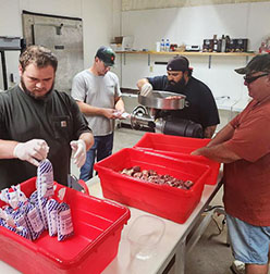 students processing game meat